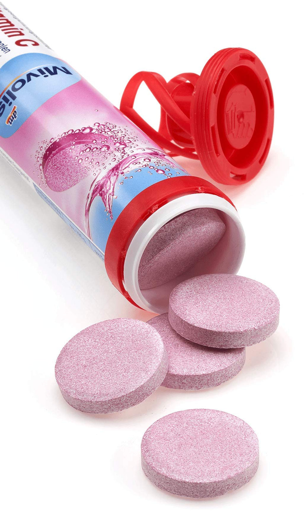 Mivolis effervescent tablets dissolving in water with citrus fizz