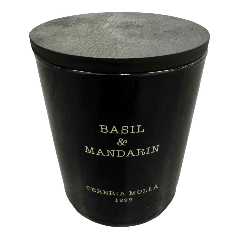 Molla 1899 handmade basil-mandarin candle in a jar offers a fresh, spring-like fragrance.