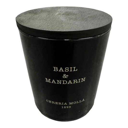 Molla 1899 handmade basil-mandarin candle in a jar offers a fresh, spring-like fragrance.