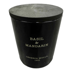 Molla 1899 handmade basil-mandarin candle in a jar offers a fresh, spring-like fragrance.