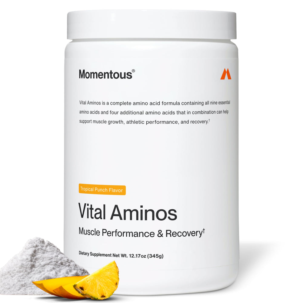 Momentous Vital Aminos Tropical Punch bottle closeup highlighting a high-protein amino acid blend for workouts.