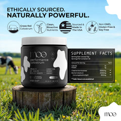 Moo Juice Colostrum Powder container close-up showing label details.