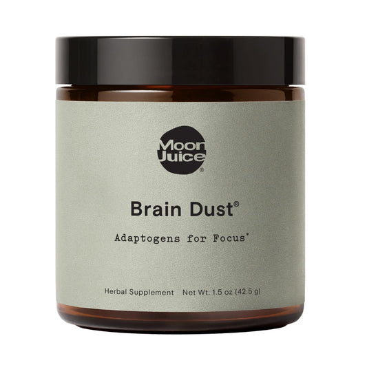 Moon Juice Brain Dust bottle closeup, showcasing sleek packaging for daily cognitive support.