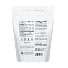 MTN OPS Immune STM raspberry flavor scoop resting over powder.