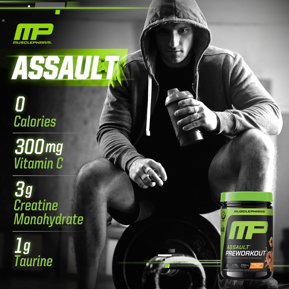 MusclePharm Assault powder being dispensed into a shaker.