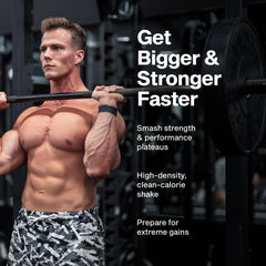 Serving scoop beside tub demonstrates easy daily mass-gain serving.