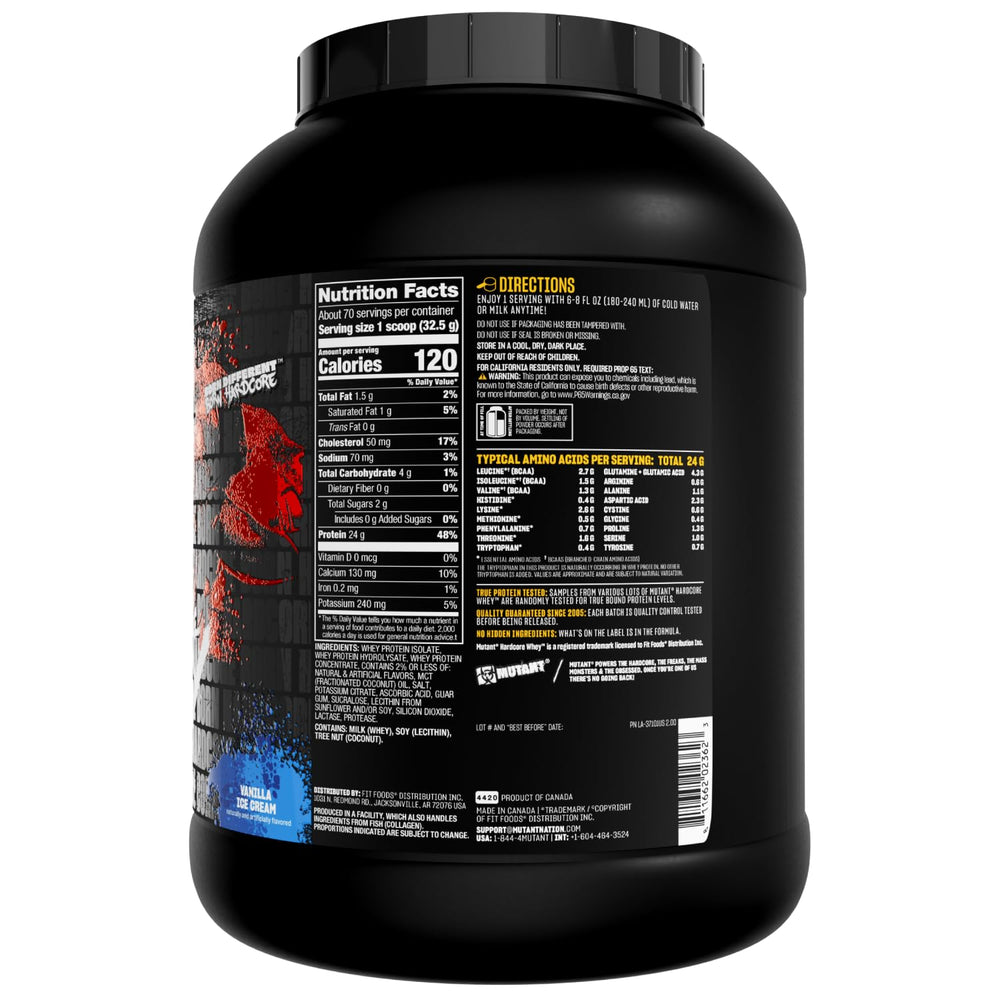 Mutant Hardcore Whey tub with spoon ready for a precise serving.