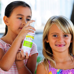 Close-up of hair care routine with Mint Lice Prevention Spray