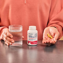 Close-up of product label shows ingredients and dosage clearly