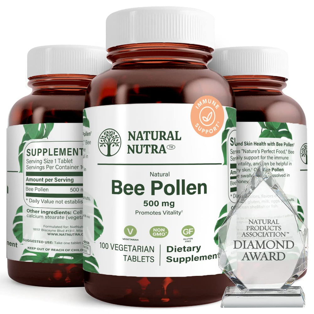 Natural Nutra Bee Pollen 500 mg bottle close-up highlights nutrient-dense tablets for vitality.