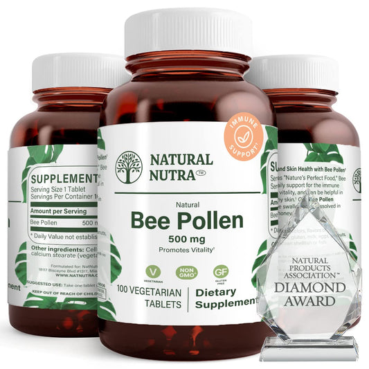 Natural Nutra Bee Pollen 500 mg bottle close-up highlights nutrient-dense tablets for vitality.