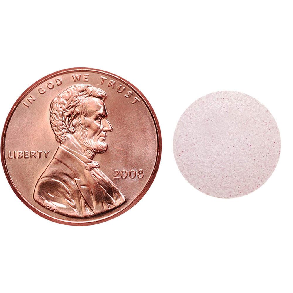 Close-up of berry-flavored Nature Made Back to Sleep tablets, designed for fast dissolution.