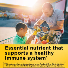 Close-up of Nature Made Vitamin E label on softgels bottle for daily use
