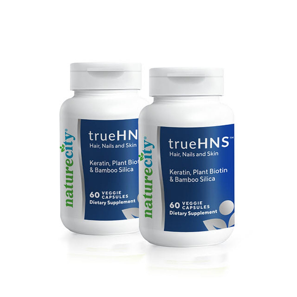 NatureCity TrueHNS bottle and capsules for hair, nails, and skin support.