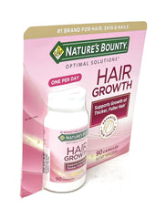 Nature's Bounty Hair Growth tablet shown during mealtime use.