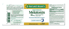 Nature's Bounty Melatonin tablet close-up shows fast-dissolve action.