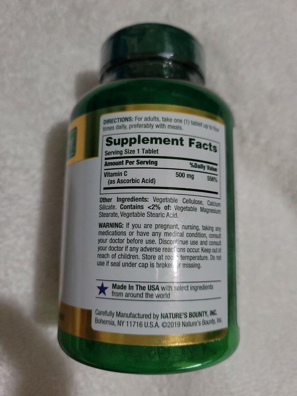 Nature's Bounty Pure Vitamin C bottle label highlights quality and safety
