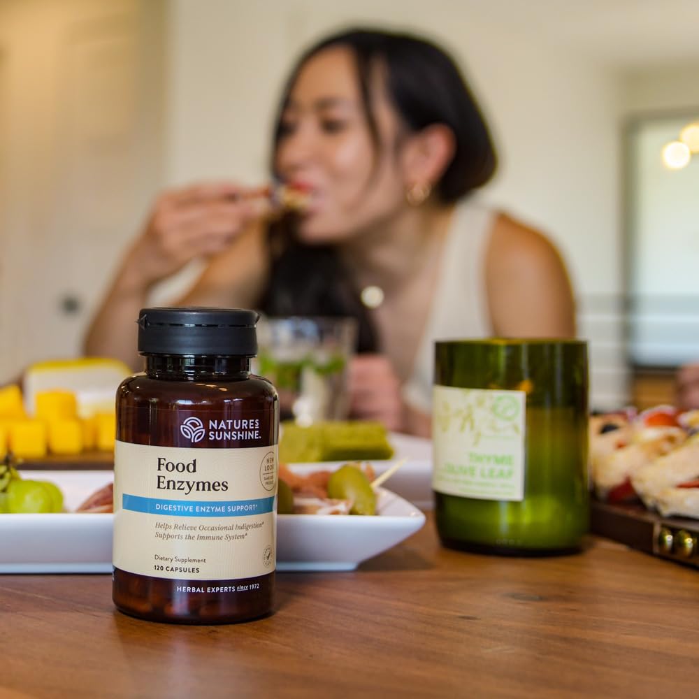 Nature's Sunshine Food Enzymes with a glass of water for daily use.