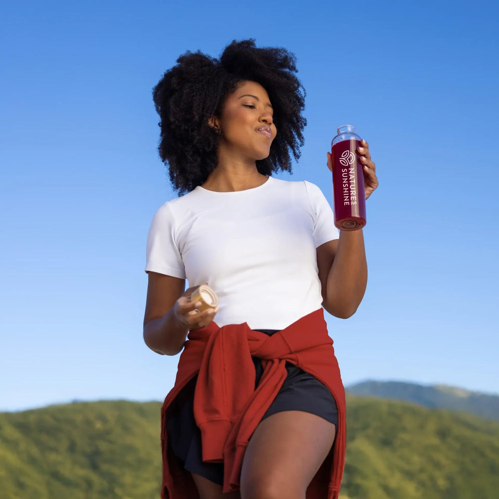 Nature's Sunshine Power Beets powder scoop beside label showing non-GMO and gluten-free