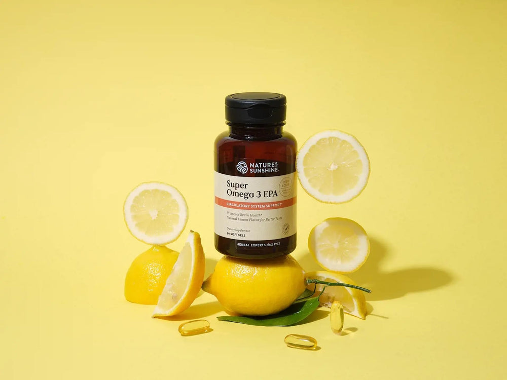 Nature's Sunshine Super Omega-3 EPA 180 Softgels capsules poured into a spoon illustrate dose.