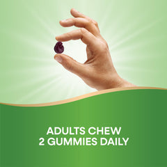 Person taking Nature's Way CranRx gummies as part of daily routine