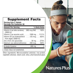 Tablets arranged to indicate 30 servings of NaturesPlus Immune Boost.