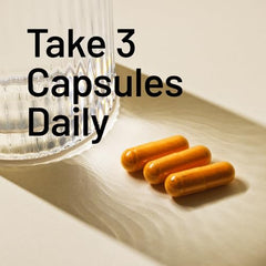 NatureWise Curcumin Turmeric bottle on table staged for everyday routine.