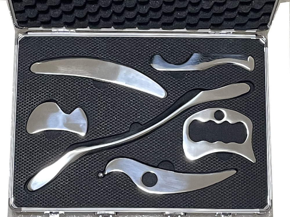 NCCYOOT six-piece gua sha set in polished steel for smooth, controlled massage.
