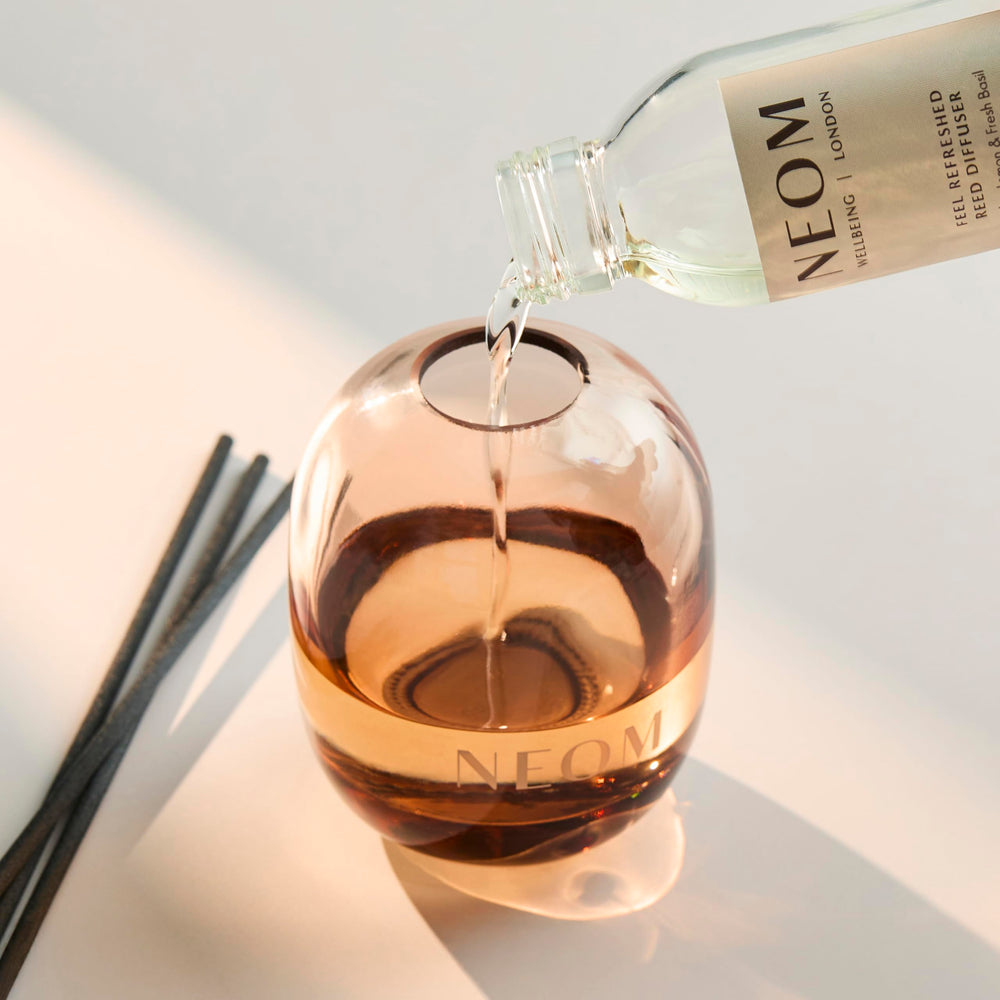 NEOM Feel Refreshed glass vessel highlighting refill option