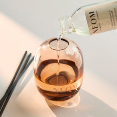 NEOM Feel Refreshed glass vessel highlighting refill option