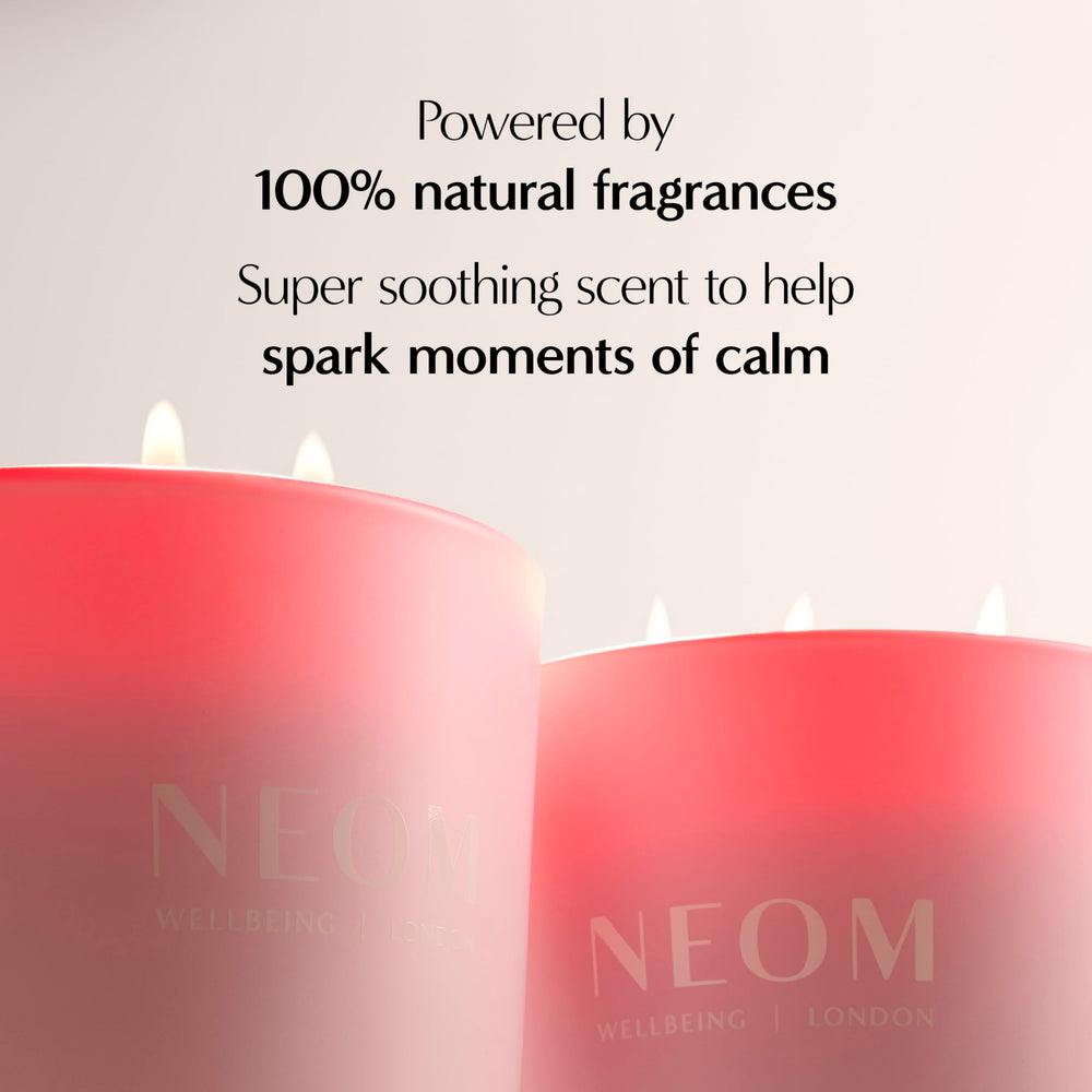 NEOM It's All Rosy Candle on table creating soft ambience.