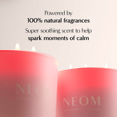 NEOM It's All Rosy Candle on table creating soft ambience.