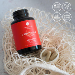 USA-made Neurogan Urolithin A capsules with GMP facility backdrop.