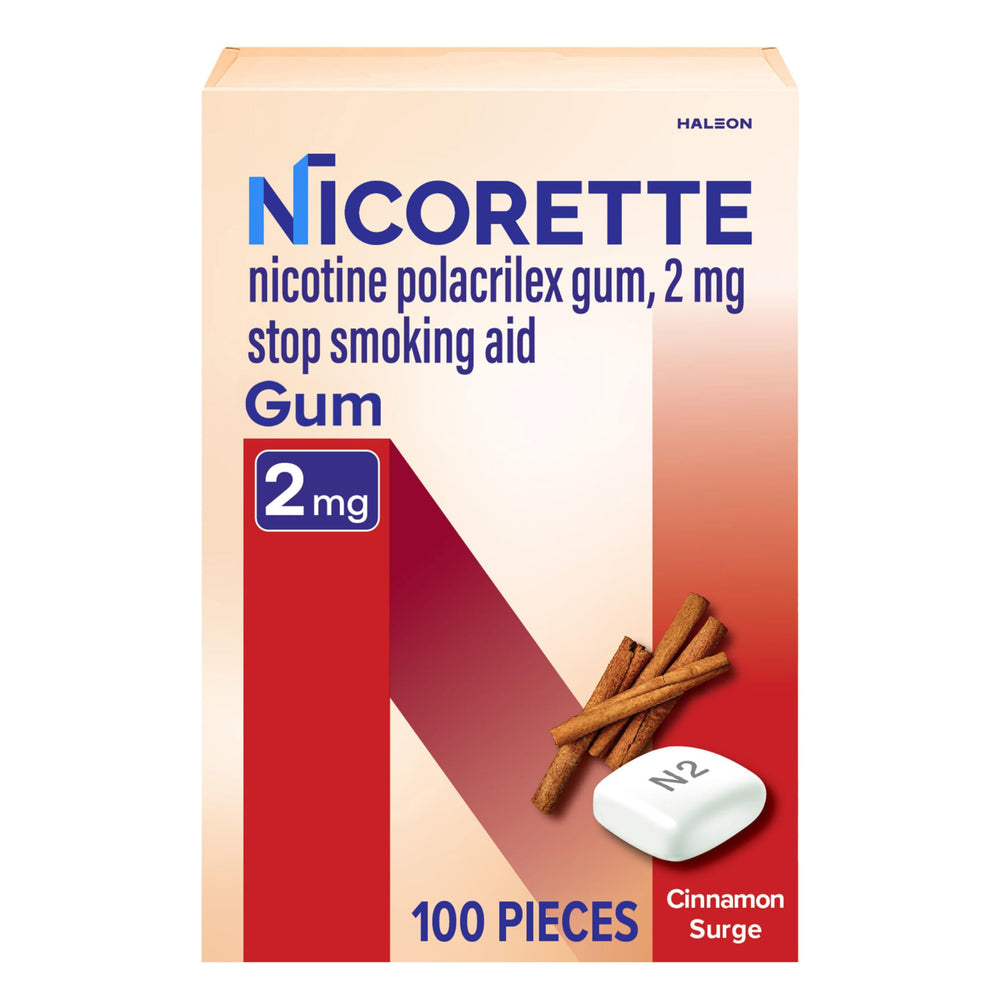 Nicorette Cinnamon Surge gum pack on desk aids cravings management during a quit attempt.