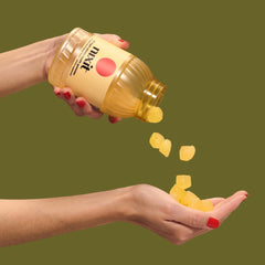 Nixit gummies pouring to emphasize ease of daily urinary tract care.