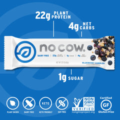 No Cow Blueberry Cobbler bar outdoors during hike suggests keto-friendly snacking option.