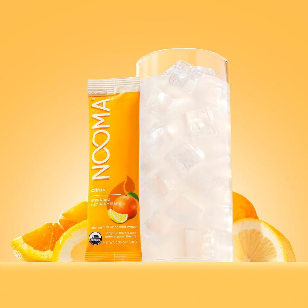 NOOMA hydrating electrolyte mix citrus packet closeup, showcasing USDA Organic ingredients.