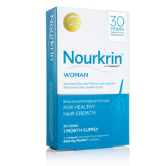Nourkrin Woman tablet swallowing close-up emphasizing easy-to-swallow design.