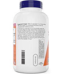 Water glass beside NOW D-Mannose capsules for easy use.