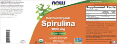NOW Foods non-GMO label on spirulina bottle emphasizing purity.