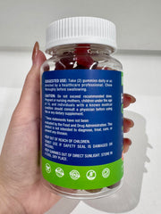 Serving suggestion beside a glass of water with Nubetong gummies