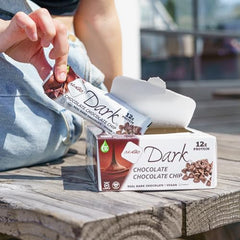 Closeup of the NuGo bar's glossy dark chocolate dip and smooth texture