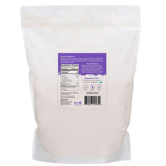 NuNaturals White Stevia Powder being scooped for easy measurement in beverages