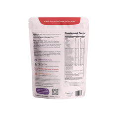 Nurished Mighty Strawberry Milk glass with shake-ready mix.
