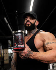 Bloodline bottle with glass of water, emphasizing hydration for endurance.