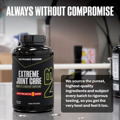 NutraBio Extreme Joint Care bottle with water shows easy-to-swallow capsules.