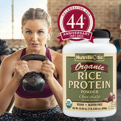 NutriBiotic shake glass demonstrates a smooth vegan drink with chocolate flavor