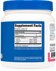 Nutricost BCAA Raspberry Lemonade dissolves clearly in water in a glass.