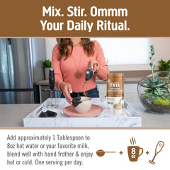Spoon and mug show Om Mushroom Superfood Coffee Latte Blend powder mixing easily.