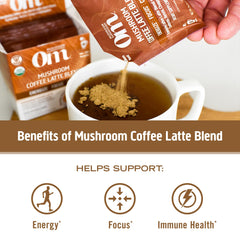 Steaming latte prepared with Om Mushroom Superfood Coffee Latte Blend for a balanced pick-me-up.